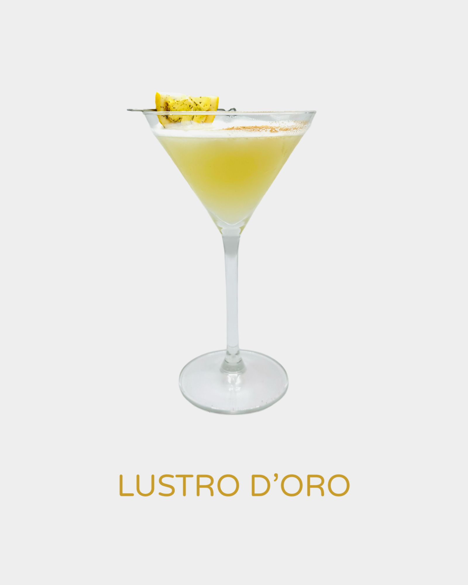 Lustro D’Oro cocktail in a martini glass with a frothy golden-yellow hue, garnished with a lemon twist. A luxurious, citrus-infused cocktail made with handcrafted organic limoncello from Iannetelli Liqueurs