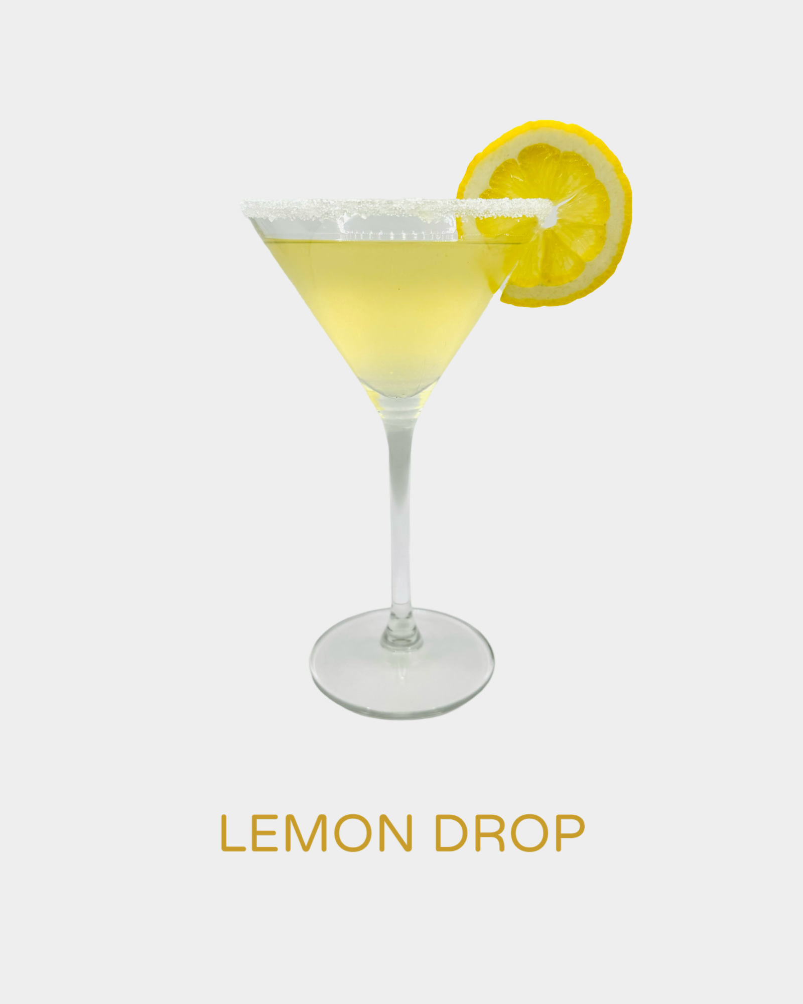 Lemon Drop cocktail in a martini glass with a sugared rim, pale yellow color, and a fresh lemon slice garnish. A zesty and refreshing classic cocktail made with handcrafted organic limoncello from Iannetelli Liqueurs.